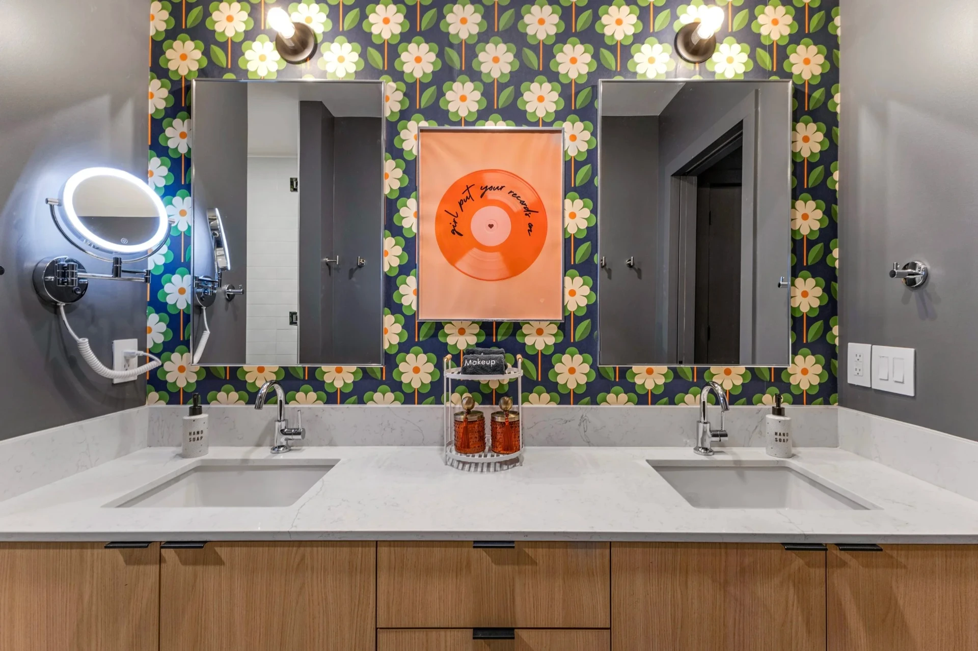 Double vanity with daisy wallpaper & 'Records On' print