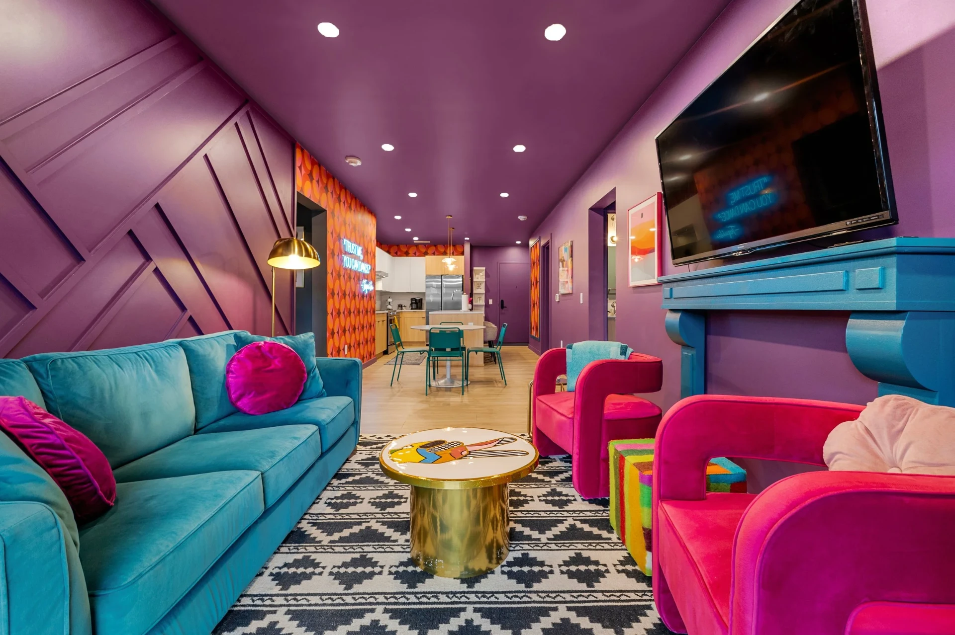 Retro living room with velvet sofas & gold accents