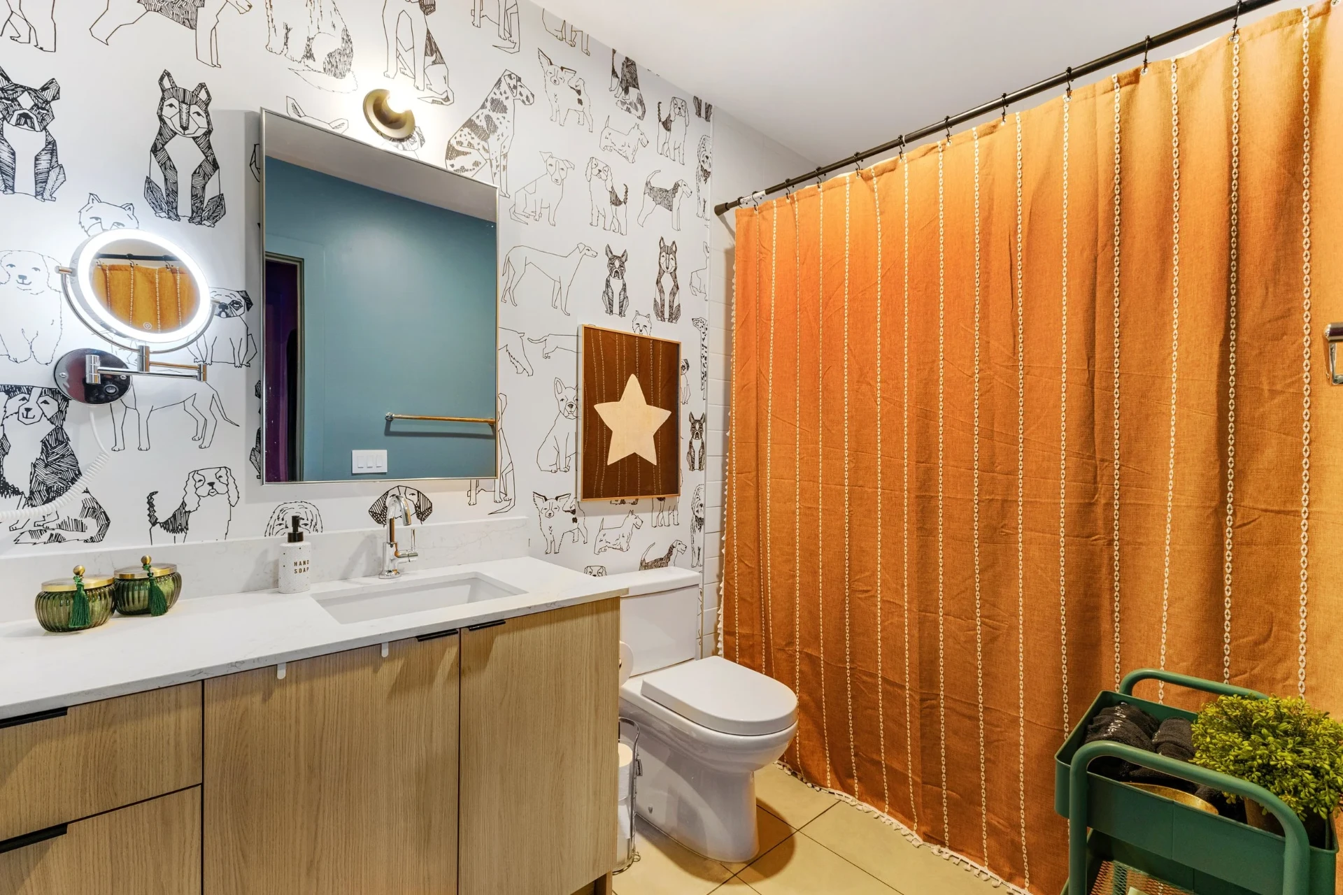 Dog-wallpaper bath with orange shower curtain