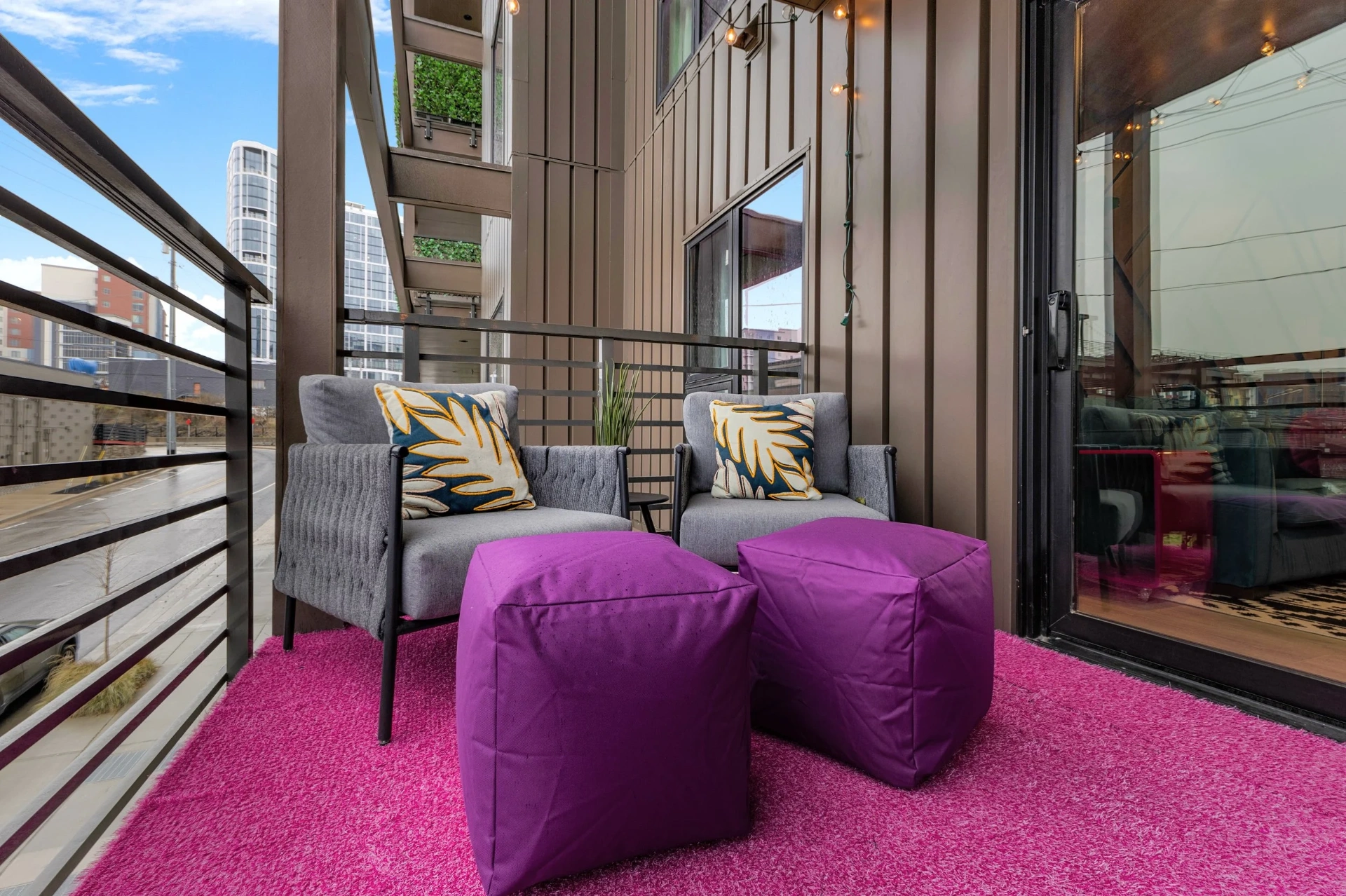 Balcony chairs with purple ottomans
